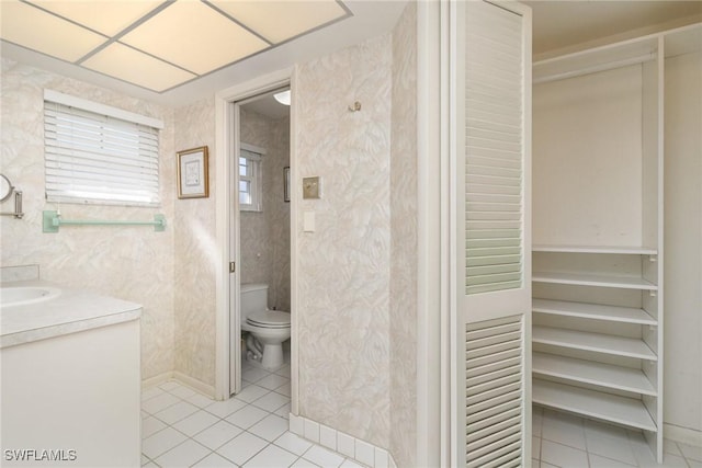 bathroom with tile patterned floors, vanity, and toilet