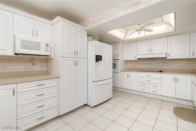 kitchen featuring ceiling fan, white cabinets, light tile patterned flooring, and white appliances