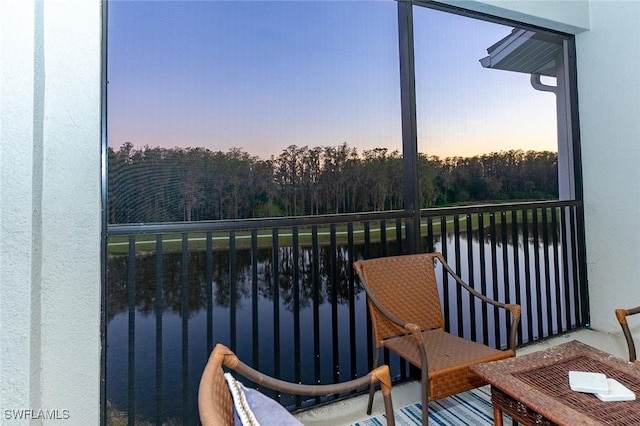 balcony at dusk with a water view