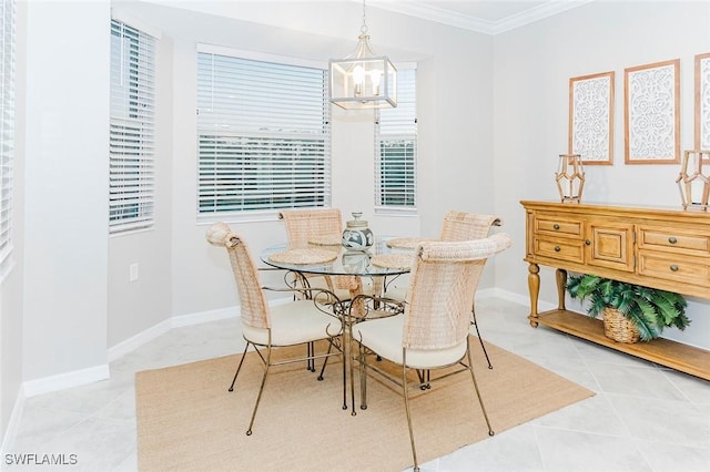 dining room with light tile patterned floors, a chandelier, and ornamental molding