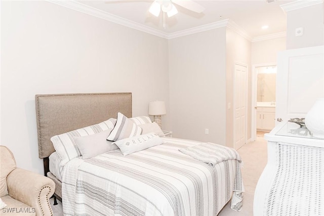 carpeted bedroom featuring ensuite bath, ceiling fan, and crown molding