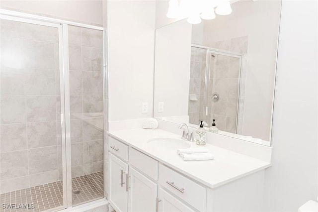 bathroom with vanity and walk in shower