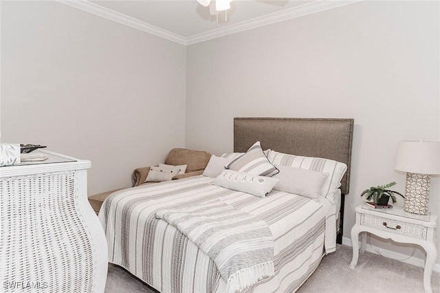 bedroom featuring ceiling fan, crown molding, and carpet