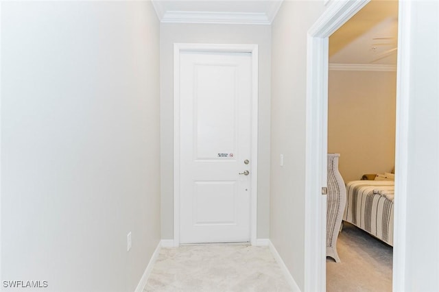 corridor featuring light carpet and ornamental molding