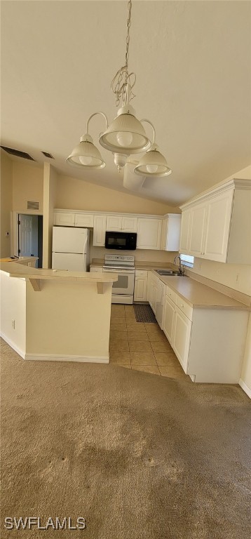 kitchen featuring white appliances, vaulted ceiling, sink, white cabinets, and carpet floors