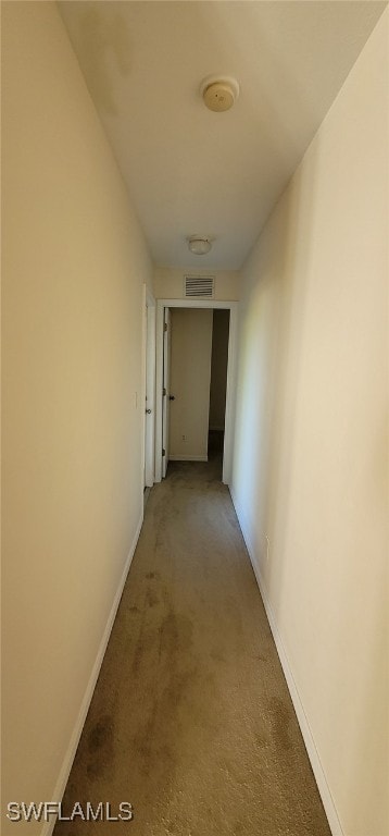 corridor with carpet flooring