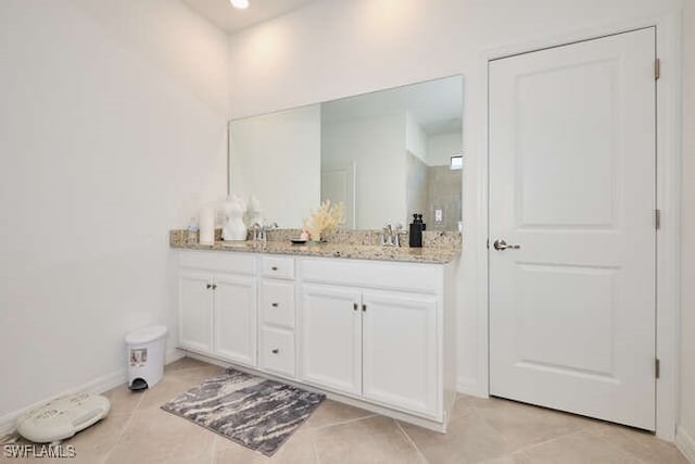 bathroom featuring tile patterned floors and vanity