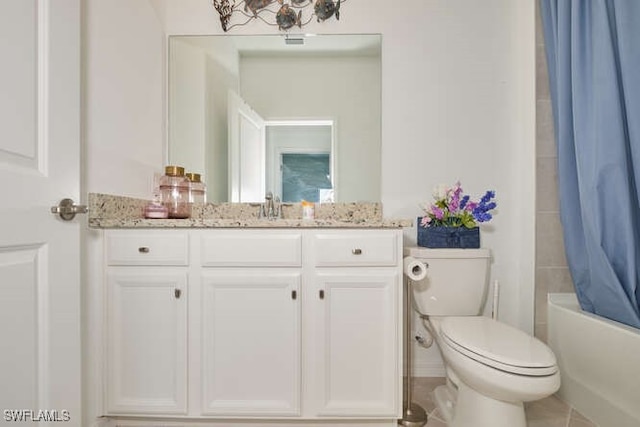 full bathroom with tile patterned flooring, vanity, shower / bath combination with curtain, and toilet