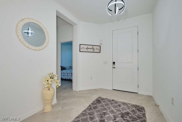 3426 Menores Way, Fort Myers, FL 33905 - foyer entrance with baseboards and tile patterned floors