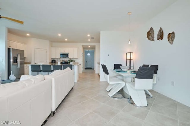 3426 Menores Way, Fort Myers, FL 33905 - living area with recessed lighting, ceiling fan, and light tile patterned floors