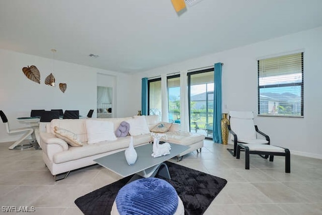 3426 Menores Way, Fort Myers, FL 33905 - living area featuring light tile patterned floors and baseboards