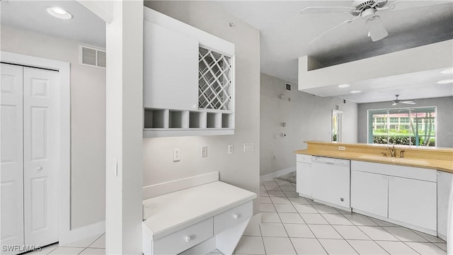 bathroom with tile patterned flooring, ceiling fan, and sink