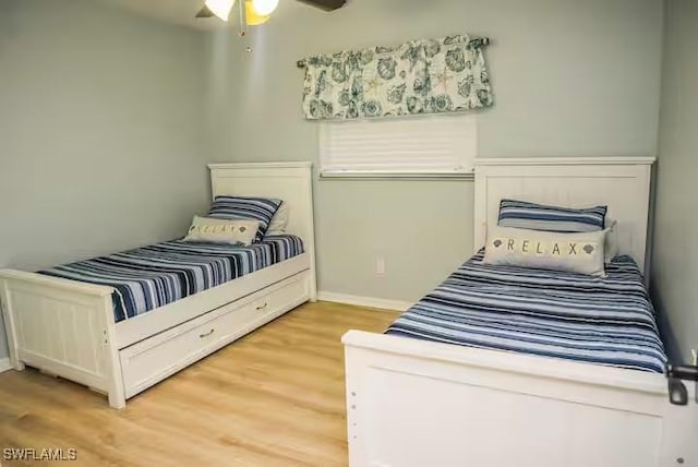 bedroom with ceiling fan and light hardwood / wood-style flooring