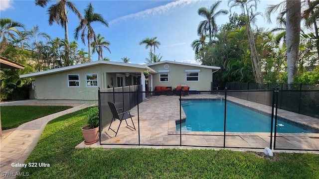 view of pool featuring a lawn, a patio area, and ceiling fan