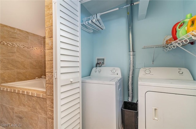 washroom featuring independent washer and dryer