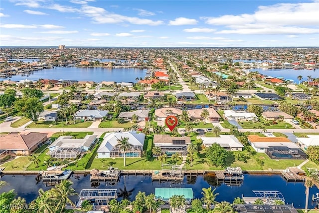 bird's eye view featuring a water view and a residential view