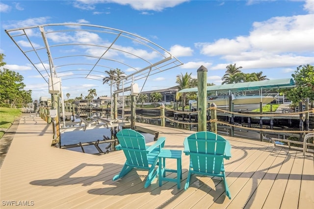 deck with a dock, a water view, and boat lift