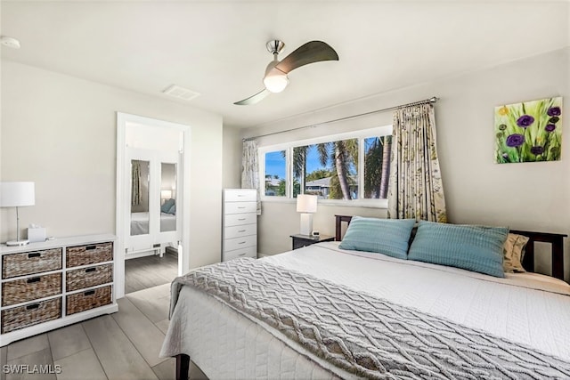 bedroom featuring hardwood / wood-style floors and ceiling fan