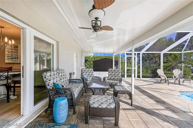 view of patio / terrace featuring ceiling fan, a lanai, and an outdoor living space