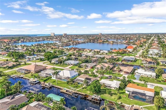 aerial view featuring a water view and a residential view