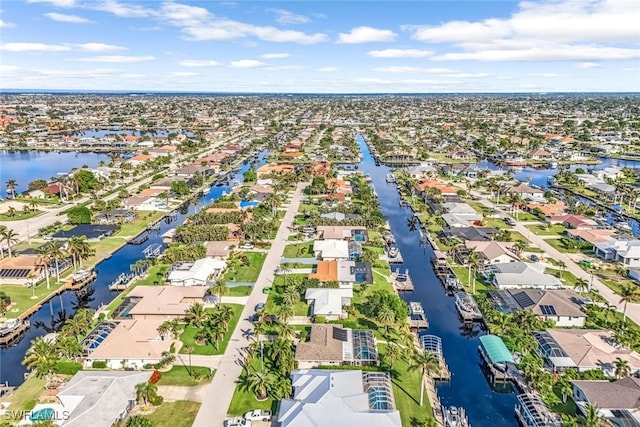 bird's eye view featuring a residential view and a water view