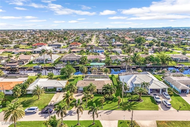 birds eye view of property with a residential view