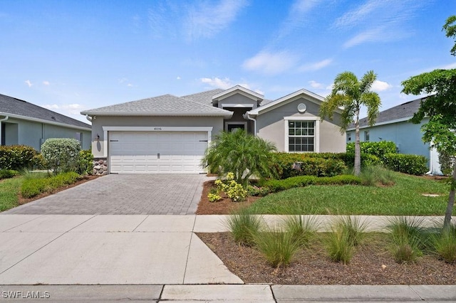 ranch-style home featuring a garage