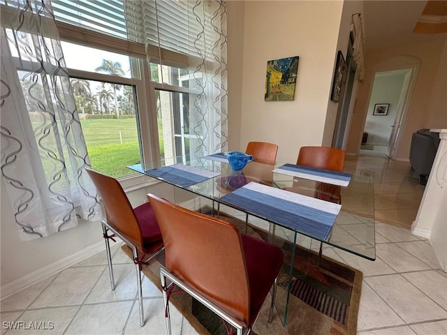 dining area with light tile patterned floors