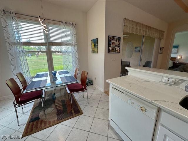 dining space with light tile patterned floors