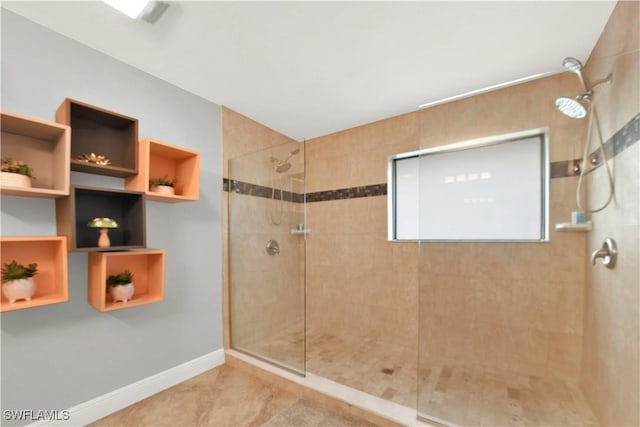 bathroom with tiled shower