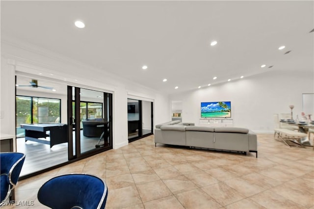 living room featuring ceiling fan and ornamental molding