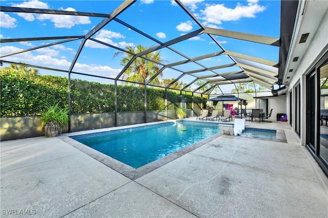 view of pool featuring a patio area and a lanai