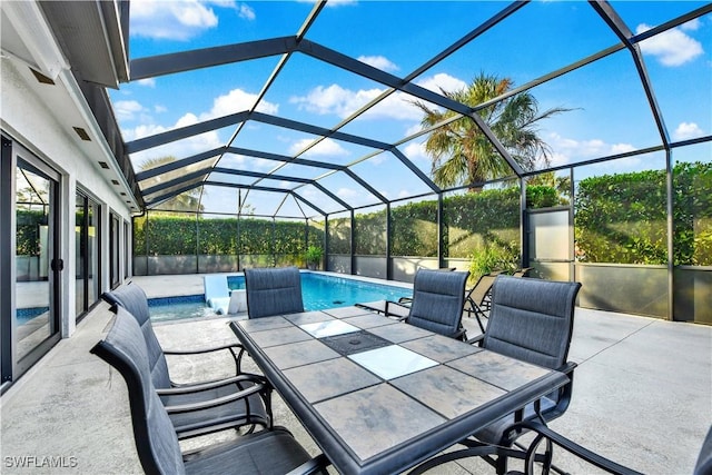 view of patio / terrace featuring glass enclosure