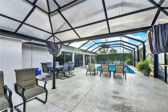 view of patio / terrace featuring a lanai