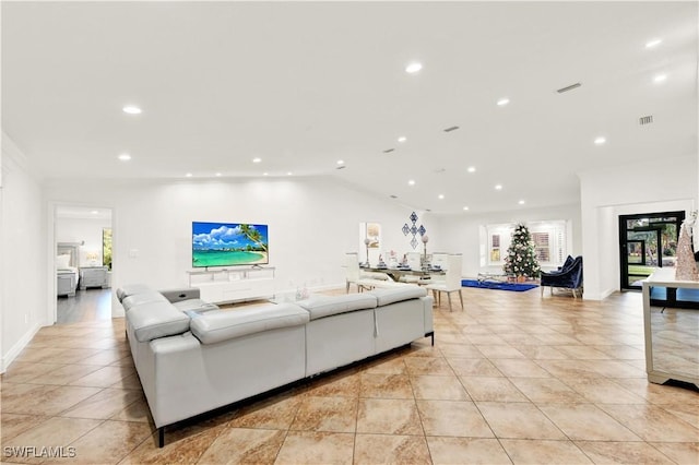 tiled living room featuring lofted ceiling