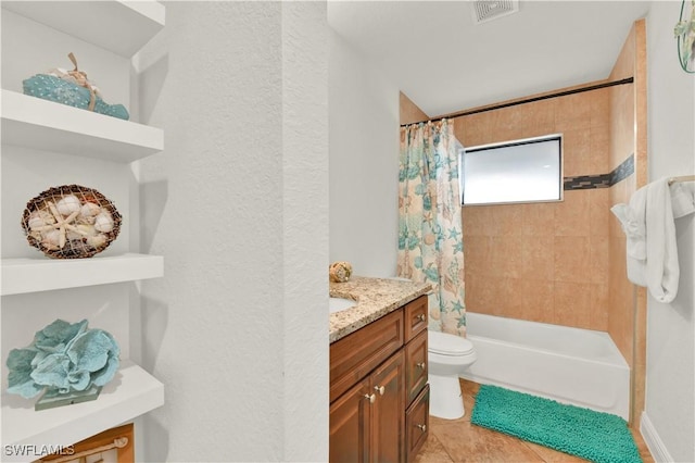 full bathroom featuring tile patterned flooring, vanity, toilet, and shower / bath combo with shower curtain