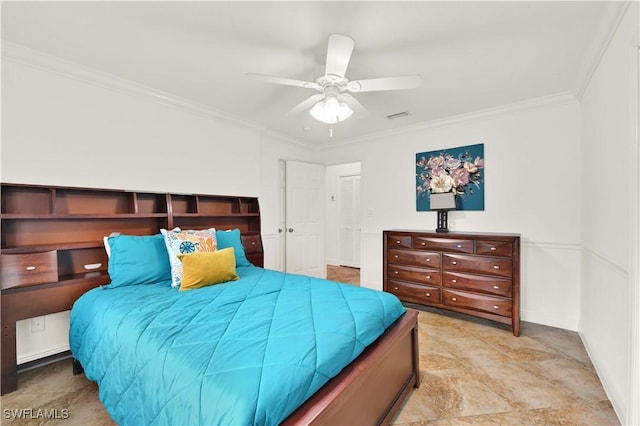 bedroom with ceiling fan and ornamental molding