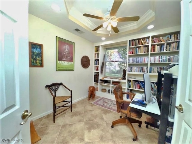 sitting room featuring ceiling fan, a raised ceiling, light tile patterned floors, and crown molding