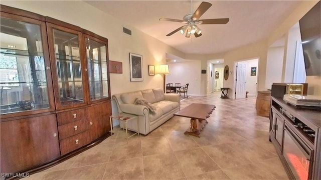 living room featuring ceiling fan and light tile patterned flooring