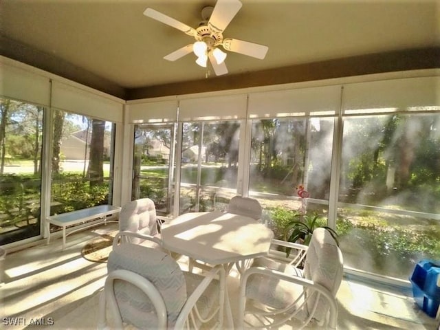 sunroom / solarium featuring ceiling fan