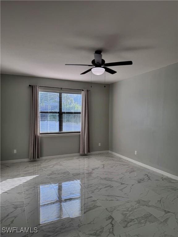 unfurnished room with ceiling fan