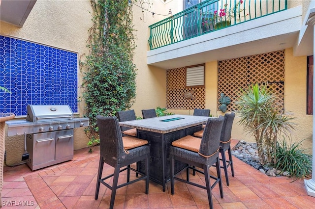 view of patio / terrace featuring a balcony