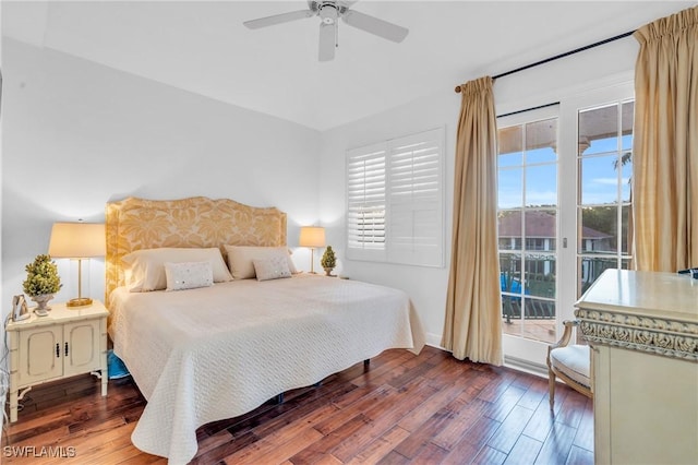 bedroom with multiple windows, dark hardwood / wood-style floors, and ceiling fan