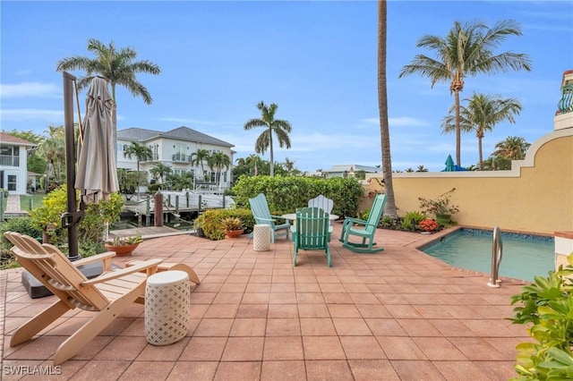 view of patio featuring a pool