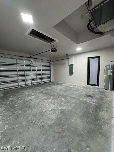 garage with electric panel, a garage door opener, and water heater