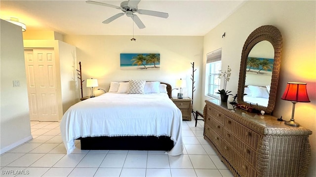 tiled bedroom with ceiling fan