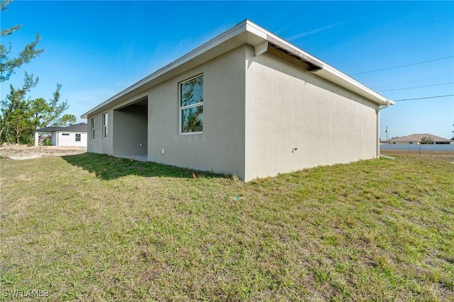 back of house with a yard