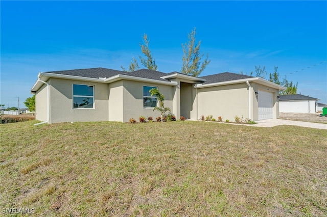 ranch-style house with a garage and a front lawn