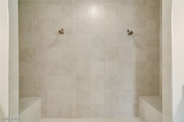 bathroom featuring tiled shower