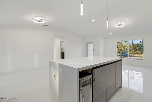 3306 E 7th St, Lehigh Acres, FL 33972 - kitchen featuring light tile patterned floors, beverage cooler, recessed lighting, light countertops, and gray cabinets